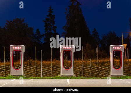 Stockholm, Sweden - September 13, 2018: Modern Tesla supercharger at night near Stockholm. Sweden. Stock Photo