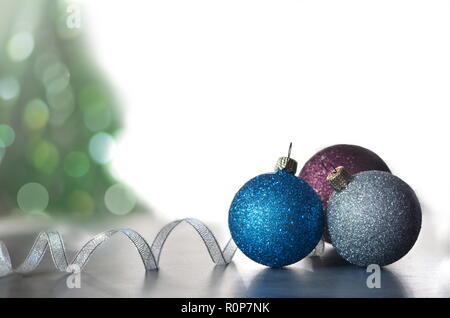 Christmas Holiday Background decorated with baubles, light garland. Christmas and New Year Decoration. Stock Photo