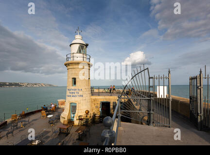 The lighthouse during a September afternoon on the Folkestone Harbour Arm, Kent, UK. Stock Photo