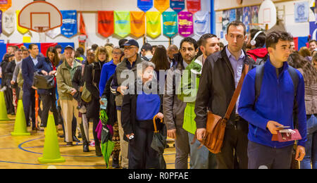 Arlington, Virginia, USA. 6th November, 2018. Voters in long queue during midterm voting, at Key School. Rob Crandall/Alamy Live News Stock Photo