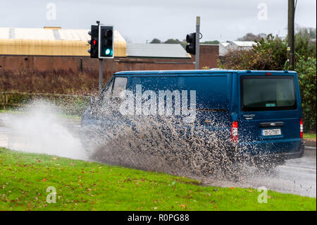 Clonakilty, West Cork, Ireland. 6th Nov, 2018. A van drives through a pool of water after a morning of torrential rain in Clonakilty. Rain is forecast for the rest of the week with Friday being very wet and windy. Credit: AG News/Alamy Live News. Stock Photo