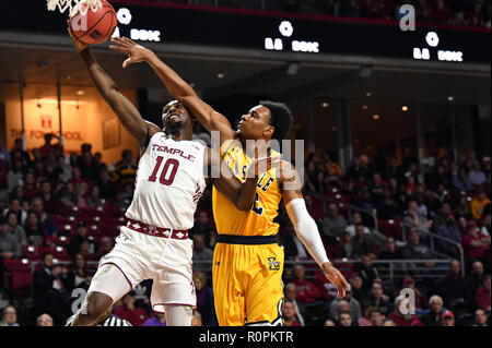 Philadelphia, Pennsylvania, USA. 6th Nov, 2018. Temple Owls guard SHIZZ ALSTON JR. (10) is fouled by La Salle Explorers guard CHEDDI MOSELY (12) during the Big 5, and season opening basketball game for both teams being played at the Liacouras Center in Philadelphia. Credit: Ken Inness/ZUMA Wire/Alamy Live News Stock Photo