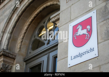 07 November 2018, Lower Saxony, Osnabrück: View of the entrance from the district court. Next to it is a shield with the coat of arms of the state of Lower Saxony. Photo: Friso Gentsch/dpa Stock Photo