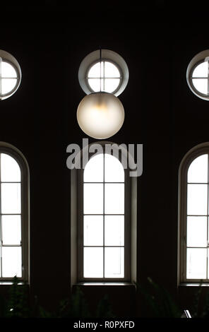07 November 2018, Lower Saxony, Osnabrück: Round and curved windows can be seen in the stairwell of the District Court. Photo: Friso Gentsch/dpa Stock Photo