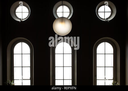 07 November 2018, Lower Saxony, Osnabrück: Round and curved windows can be seen in the stairwell of the District Court. Photo: Friso Gentsch/dpa Stock Photo