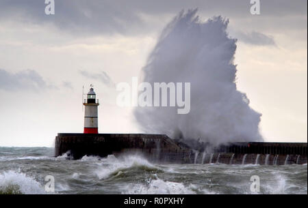 Newhaven, East Sussex, UK. 7th November 2018. Huge waves crash against the sea wall in Newhaven Harbour, East Sussex, as gale force winds batter the south coast. Credit: Peter Cripps/Alamy Live News