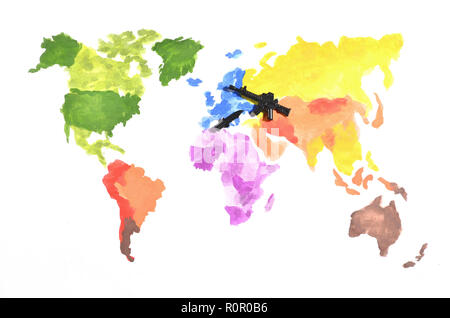 The world map is made with colored watercolor paints on white paper with the participation of a black toy gun and a knife. The concept of military ope Stock Photo