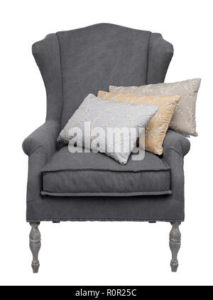 Traditional grey arm chair with 3 floral cushions, isolated on a white background. Stock Photo