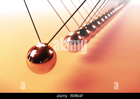 Newton's cradle, action and reaction concept, series of swinging spheres, device that demonstrates conservation of momentum and energy Stock Photo