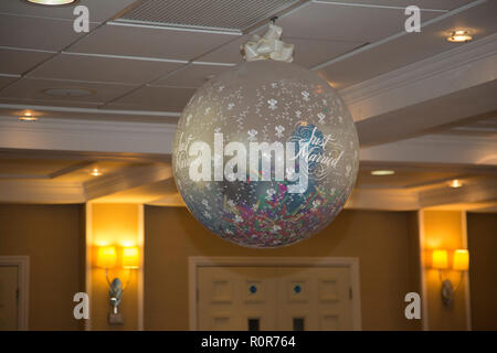First Dance balloon full of confetti ready for the bride and groom to dance underneath Stock Photo