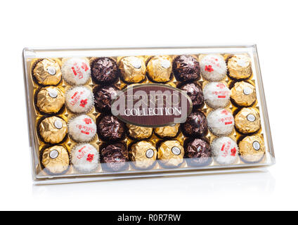 LONDON, UK - NOVEMBER 08, 2018: Ferrero Collection Rocher premium chocolate sweets plastic box.On white background with reflection. Raffaello and Rond Stock Photo