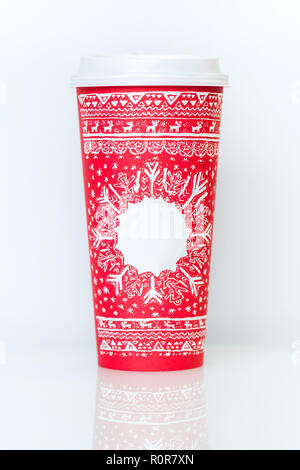 Paper coffee cup with red christmas pattern and empty place for title isolated on white Stock Photo