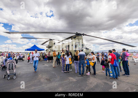 October 6, 2018 Livermore / CA / USA - People visiting a military helicopter at the Livermore Municipal Airport Open House event Stock Photo