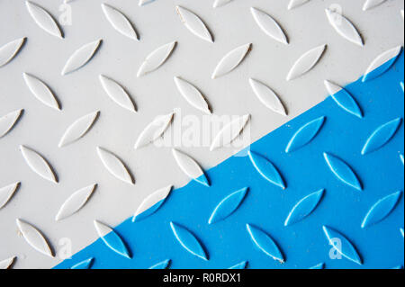 Painted white and blue Metal checkered steel plates background. Industrial texture Stock Photo