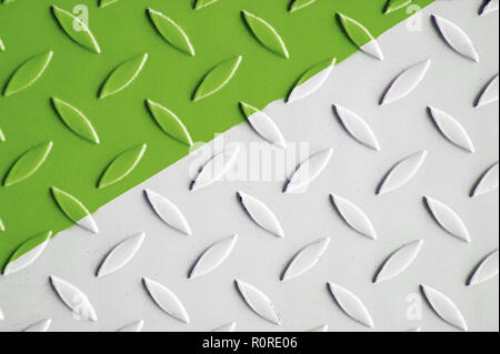 Painted white and green Metal checkered steel plates background. Industrial texture Stock Photo