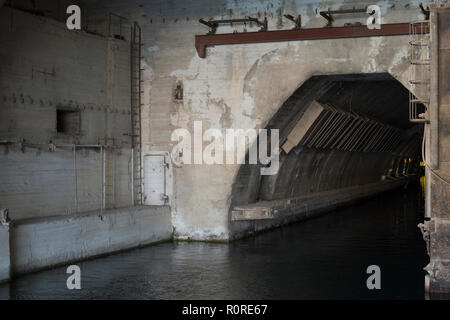 the entrance to the concrete bunker with the entrance from the water side. entry for ships Stock Photo