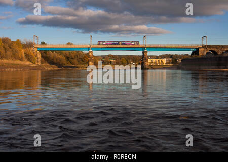 A Arriva Northern Rail class 142 pacer train crosses the viaduct over the river lune at Lancaster on the west coast main line. Stock Photo