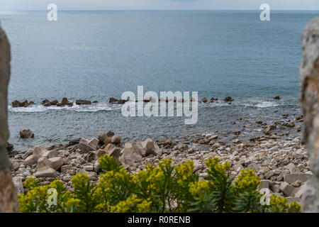 Partly artificial wave breakers on the beautiful rocky Montenegrian coast near Petrovac and Budva in summer, Montenegro Stock Photo