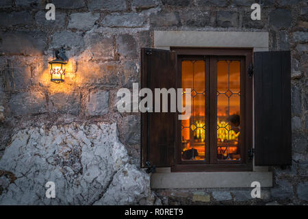 Small wooden window and shutters of a local cafe in Petrovac, Montenegro Stock Photo