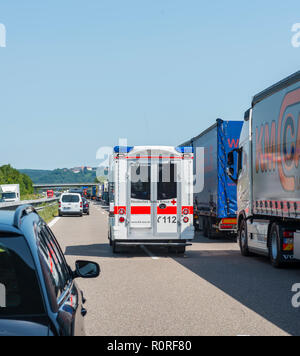 Ambulance drives through rescue lane, traffic jam on motorway, Bavaria, Germany Stock Photo