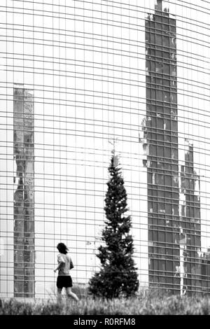 Running in the city park of Giardini di Porta Nuova, Milan - Italy Stock Photo