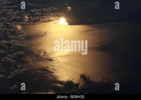 Arial view of Sun reflected on water Stock Photo