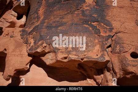 Ancient petroglyphs by native american peoples as seen along Mouses Tank trail in the Valley of Fire State Park in Nevada Stock Photo