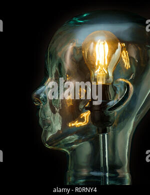 Bright lightbulb inside glass head for creative thoughts and ideas concept Stock Photo