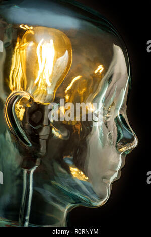 Bright lightbulb inside glass head for creative thoughts and ideas concept Stock Photo