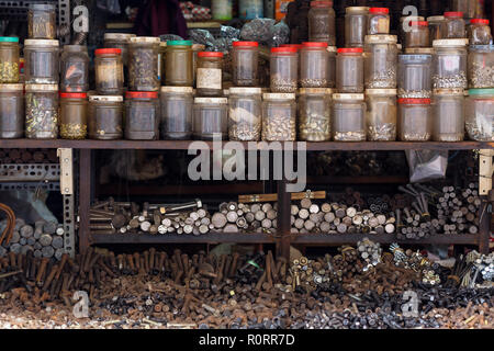 Sorted screws,nuts and bolts in a Vietnamese street hardware store Stock Photo