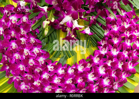 Traditional Vietnamese orchid flower religious wreath in a Saigon market. Stock Photo