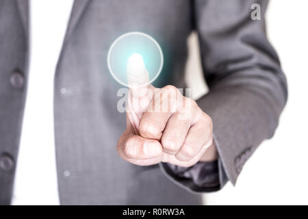 Businessman in gray suit pushing on round transparent button. Stock Photo