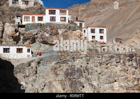 Buddhist monks and part of Phugtal Gompa (also known as Phuktal Gompa), Zanskar, Jammu and Kashmir, India Stock Photo