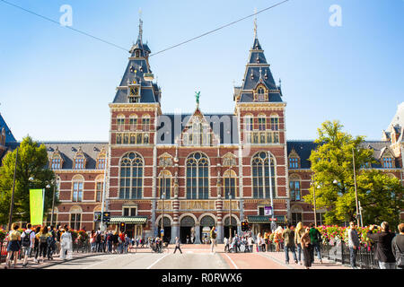 AMSTERDAM, NETHERLANDS - SEPTEMBER 2, 2018: Exterior for of the historic Rijksmuseum with people in view Stock Photo