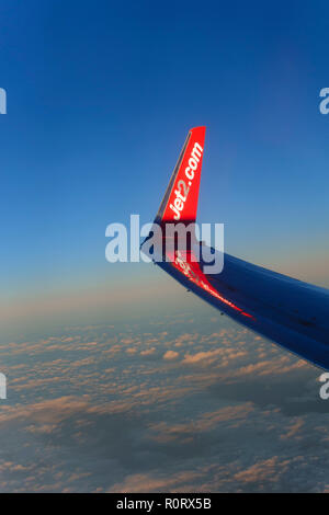 Boeing Jet2.com wing over a cloudscape at 30,000 feet.