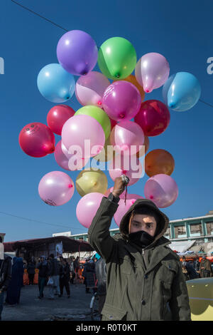 Boy Selling Colourful Balloons In The Alleys The Mazar-e Sharif Central Bazaar, Maraz-e Sharif, Balkh Province, Afghanistan Stock Photo