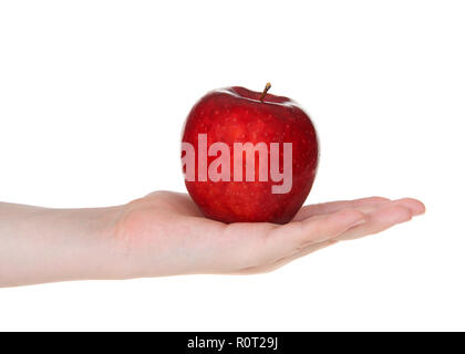 Young female hand holding one delicious red apple in open palm isolated on white background. Stock Photo