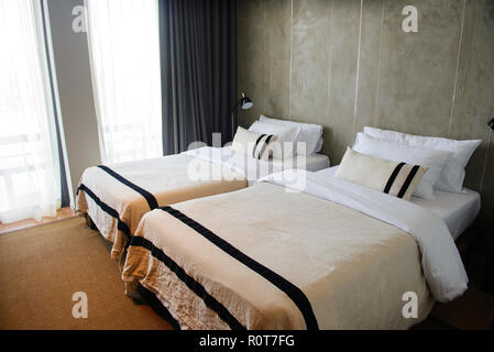Modern hotel room with twin beds interior Stock Photo