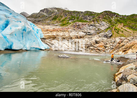 Glacier Svartisen, under a glacier, thawing of a glacier, blue deep color an arch from ice, Norway, rocks,  stones, nobody Stock Photo
