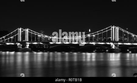 Night London bridge with bright lights and beautiful reflections in river Thames. Stock Photo