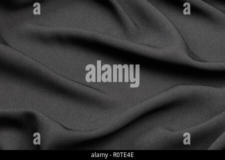 abstract black fabric wavy background, close up Stock Photo