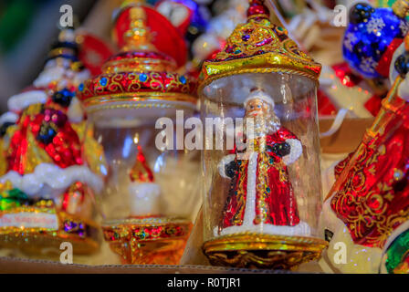 Colorful Christmas ornaments of Santa Claus on display for sale in a store Stock Photo