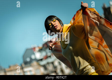 Stunning dark-haired model posing in stylish outfit Stock Photo