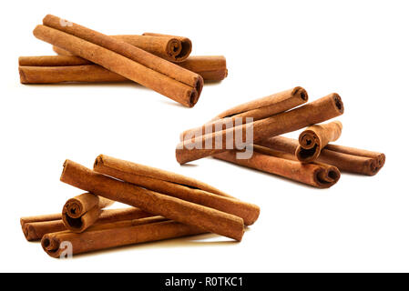 Set of cinnamon sticks on the white background Stock Photo
