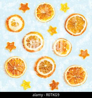 Christmas background of dried oranges, peel in the shape of a star. Seamless background Stock Photo