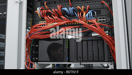 fiber optic with servers in a technology server room Stock Photo