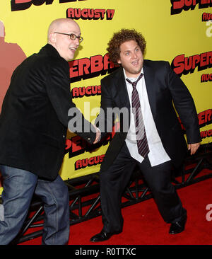 The director Greg Mottola and Jonah Hill arriving at the SUPERBAD Premiere at the Chinese Theatre in Los Angeles.  full length action          -       Stock Photo