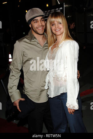 Mena Suvari and new beau Mike 'Murda' Carrasco arriving at Standing Still Premiere at the Arlight Theatre in Los Angeles. April 10 2006.          -    Stock Photo