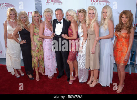 Hugh Hefner and playmates arriving at the 30th AFI Life Achievement Awards to Tom Hanks at the Kodak Theatre in Los Angeles. June 12, 2002.            Stock Photo