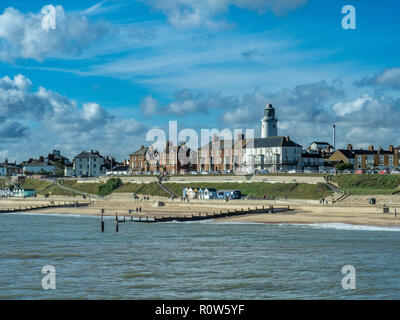 A view of Southwold including the lighthouse taken from the end of the pier on a sunny day with clouds in the blue sky Stock Photo